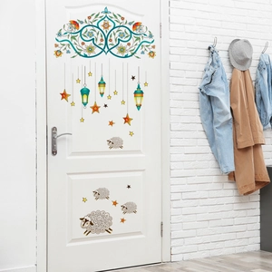 Detail view of vintage star lantern and floral arch wall stickers on a white door