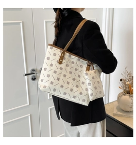 Detail of large tote bag set with clover pattern and matching small hanging pouch