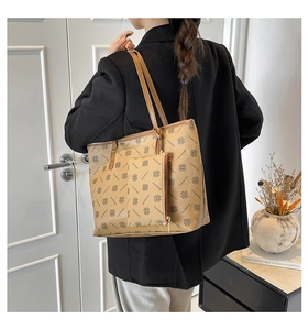 Detail of khaki tote bag set featuring diamond pattern and matching small zipper pouch