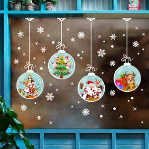 Detail of Santa and reindeer Christmas window stickers with festive snowflakes decorations