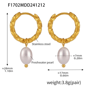 Detail showing 28mm stainless steel gold twist hoop earrings with freshwater pearl pendant