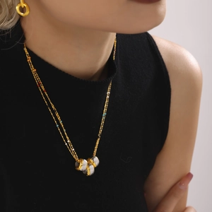 Three-layer stainless steel necklace with colorful beads and interlocking gold rings