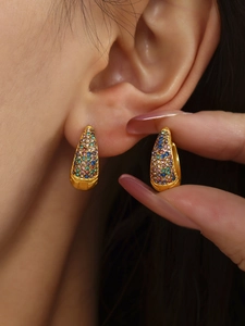 Detail of 18K gold plated huggie earrings with colorful turquoise and zircon pave setting