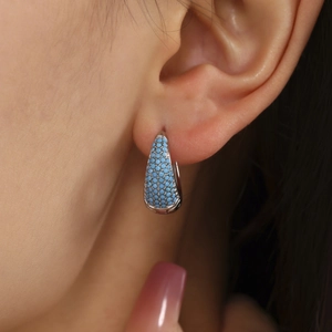 Silver teardrop hoop earrings with turquoise stones and 18K gold plated stainless steel