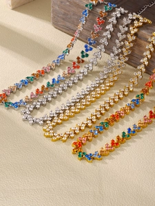 Close-up of colorful zirconia necklaces set in 18K gold and silver stainless steel