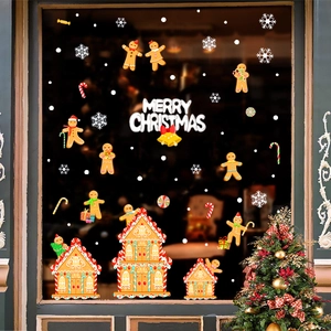 Macro detail of gingerbread house and merry christmas window stickers on glass