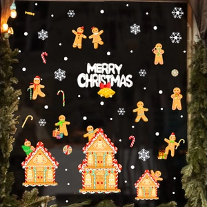 Detail of Christmas static window clings featuring gingerbread houses and snowflakes