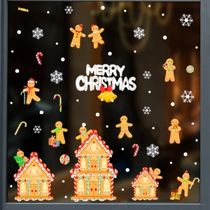 Detailed Christmas window decals featuring gingerbread houses, snowflakes and Merry Christmas text