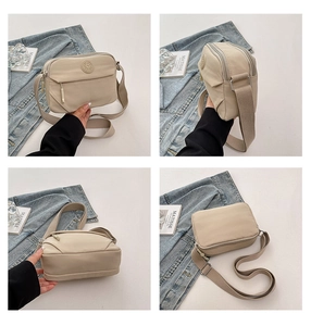 Multi-angle view of beige nylon crossbody bag with several zippered compartments