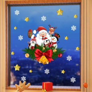 Detail of Santa and reindeer electrostatic window decals applied on glass pane