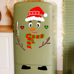 Detailed Christmas snowman wall stickers applied to a green refrigerator for holiday kitchen decor
