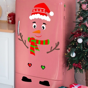 Close-up of festive snowman decals applied on a fridge with holiday decor
