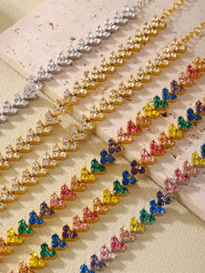 Detail of multi-color zircon heart necklace and bracelet set with 18K gold PVD plating