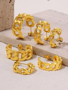 Detailed view of chunky C-shaped chain link earrings with polished 18K gold plating