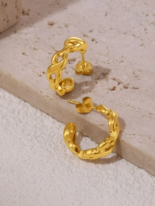 Detail of hollow C-shaped Cuban chain earrings with 18K gold PVD plating for women