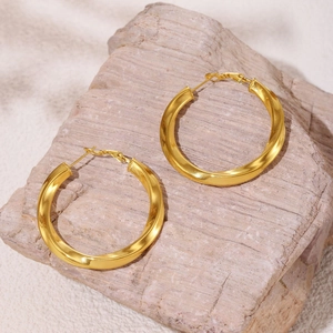 Polished 18K gold-plated stainless steel twisted hoop earrings on pink stone