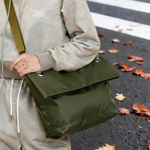 Chic olive green large tote bag with silver chain strap for outdoor urban commuting style