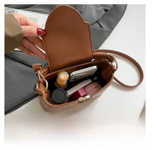 Interior view showing the storage capacity of this brown crossbody bag for women