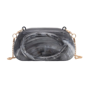 Chic acrylic marble pattern handbag with golden chain strap for elegant crossbody use