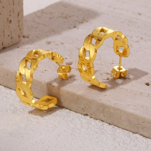 Polished 18K gold-plated stainless steel Cuban link C-shaped hoop earrings on stone