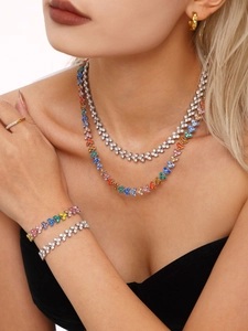 Detail of 18K gold-plated stainless steel jewelry set with colorful dopamine zircon