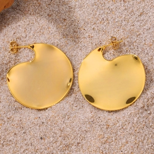 Irregular 18K gold plated stainless steel geometric earrings on sandy beach background