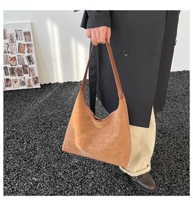 Detail of coffee brown hobo tote bag featuring Fashion & Bags logo print for women