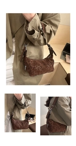Detail of leopard print underarm bag with suede texture and metal buckle strap