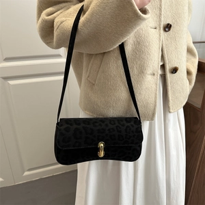 Leopard print faux suede shoulder bag with gold metal buckle for a stylish winter look