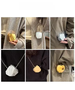 Mini mirror acrylic bags in gold and silver with metal chain shown on models