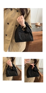 Detail of black leopard print suede handbag paired with a beige autumn trench coat