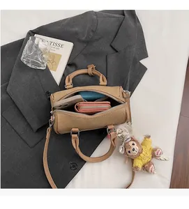 Internal view showing large capacity for phone and wallet in brown embossed handbag