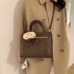 Vintage dark brown suede tote bag for women with gold zippers and plush charm