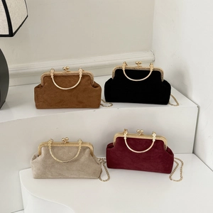 Vintage shell bags in four colors with rich rabbit embossing and golden metal handles