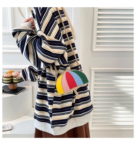 Detail of creative umbrella-shaped crossbody bag featuring vibrant five-color patchwork design