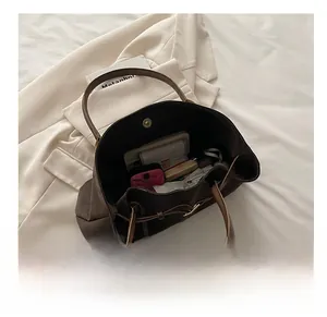Top view of large dark brown leather tote bag interior showing ample storage space