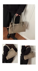 Macro detail of taupe leopard print tote bag with metallic buckle and shoulder straps