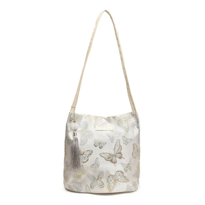 Chic off-white tote bag with gold butterfly embroidery and a stylish tassel pendant