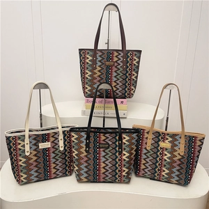 Ethnic style woven tote bag with wave pattern and stylish shoulder straps in four colors