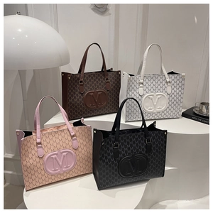 Group of four large M-letter print tote bags in black, pink, white, and brown colors
