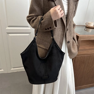 Elegant black suede hobo tote bag for women featuring a spacious retro commuter style
