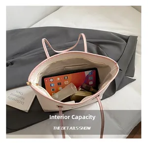 Detailed interior of large capacity pink tote showing spacious storage and zipper pocket