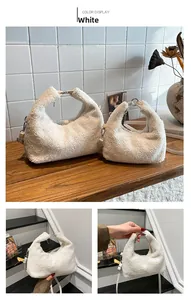 Detail of white faux fur crossbody bag with silver ring handle and chain strap
