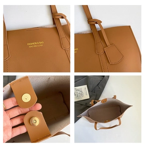 Detail view of brown leather tote bag with magnetic clasp and printed fashion logo