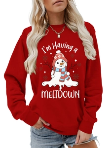 Detail of red crewneck sweatshirt featuring a creative melting snowman print and ribbed cuffs