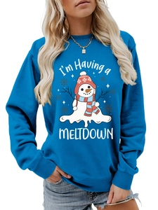 Close-up of I'm Having a Meltdown slogan and melting snowman print on blue sweatshirt