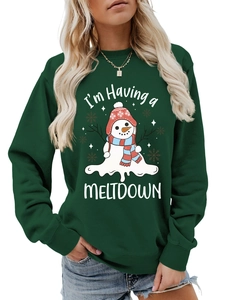 Detail of forest green sweatshirt featuring a funny melting snowman and meltdown text