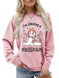 Detail view of pink crewneck sweatshirt with melting snowman print and humorous slogan