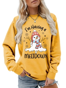Detail view of snowman graphic and 'I'm Having a MELTDOWN' text on yellow sweatshirt