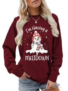 Close-up of the melting snowman graphic and 'I'm Having a MELTDOWN' text on the burgundy sweatshirt